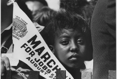 12-year-old Edith Lee-Payne attending the March on Washington and carrying a banner, 8/28/1963.