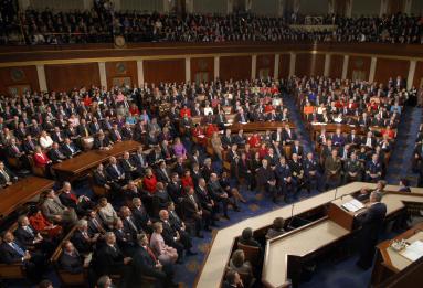 President George W. Bush is delivering his State of the Union speech at the podium on the floor of the U.S. House of Representatives