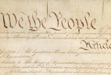 A close up of the Preamble of the U.S. Constitution, highlighting the words "We the People"